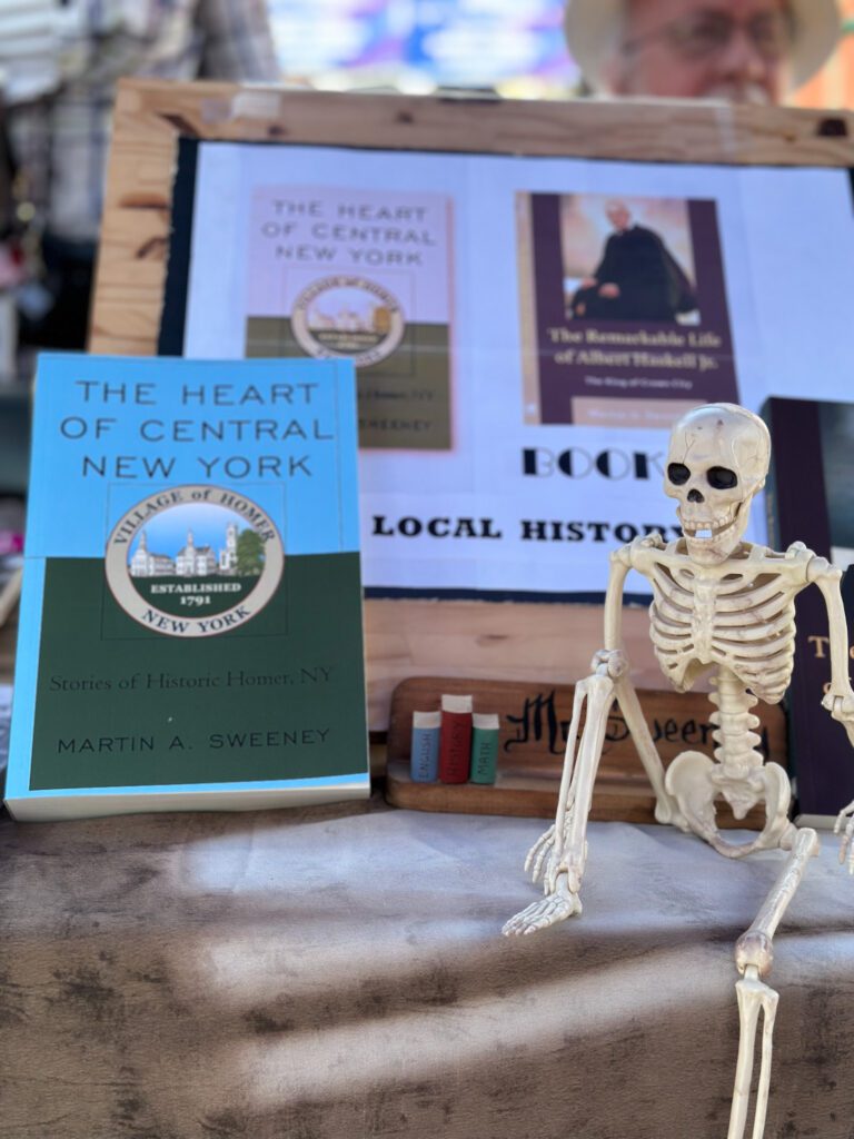 skeleton sitting by books